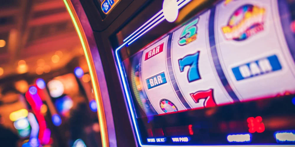 Massive Jackpot Hunts with 7E77 branding and thrilling slot visuals